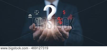 Tax With Ask Question Online Concept, Businessman Hold Interface Question Marks Tax Payment Optimiza