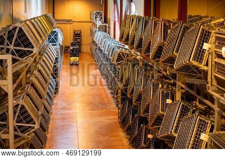 Production Of Cremant Sparkling Wine In Burgundy, France. Automatically Powered Riddling Remuage Box