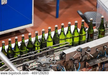 Production Of Cremant Sparkling Wine In Burgundy, France. Automatically Powered Bottling And Corking
