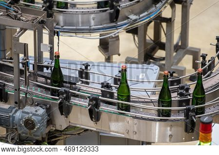 Production Of Cremant Sparkling Wine In Burgundy, France. Automatically Powered Bottling And Corking