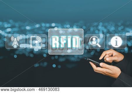 Rfid, Radio Frequency Identification Concept, Person Using Laptop Computer And Hand Touching Rfid Ic