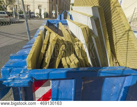 Dumpster Full Of Glass Wool Slabs. Toilet Management Waste