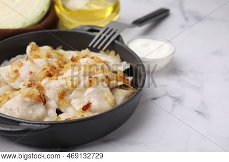 Cooked Dumplings (varenyky) With Tasty Filling And Fried Onions On White Marble Table, Closeup