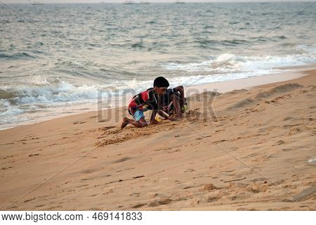 Candolim, India - February 18, 2020: Children Playing In Sand On Candolim Beach, North Goa, India