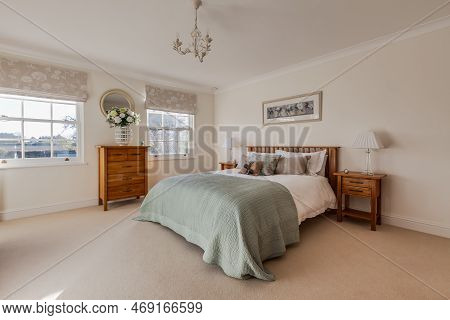 Quy, Cambridgeshire, England - December 10 2014: Furnished Luxury Bedroom With Sidetable And Chest O