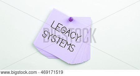 Hand Writing Sign Legacy Systems. Conceptual Photo Old Method Technology Computer System Or Applicat