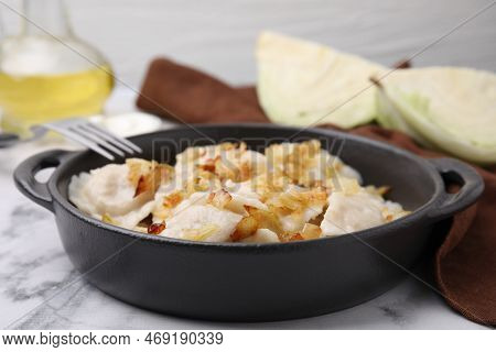 Cooked Dumplings (varenyky) With Tasty Filling And Fried Onions On White Marble Table, Closeup