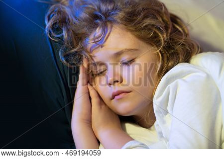 Little Kid Sleeps. Child Sleeping On Bed At Home. Bedtime, Kid Sleeps. Child Boy Asleep On Soft Pill