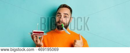 Close-up Of Funny Adult Man Celebrating His Birthday, Holding Bday Cake With Candle, Blowing Party W