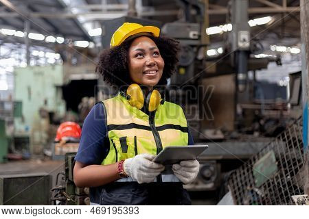Engineering Female African American Happy Smiling Workers Wear Soundproof Headphones And Yellow Helm