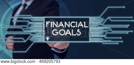 Hand Writing Sign Financial Goals. Word Written On Targets Usually Driven By Specific Future Financi
