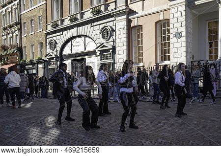 London - 02 27 2022: Girls Keep Dancing With Second Movement Of Shuffle Dance In Covent Garden With 