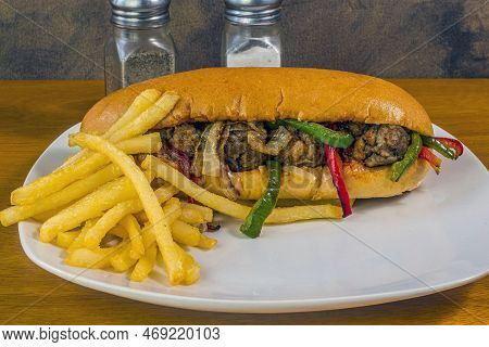 Meat Ball Sub  With Sauteed Onions And Peppers Served With Fries