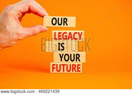 Legacy And Future Symbol. Concept Words Our Legacy Is Your Future On Wooden Blocks. Beautiful Orange