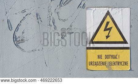 Sign With The Polish Inscription: Nie Dotykac! Urzadzenie Elektryczne. Translation: Do Not Touch! El