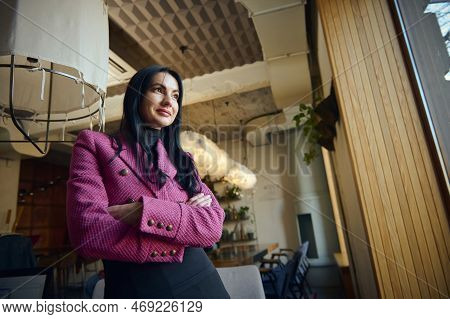 Portrait Of Beautiful Goal-oriented Businesswoman, Restaurateur, Executive Director, Standing With H