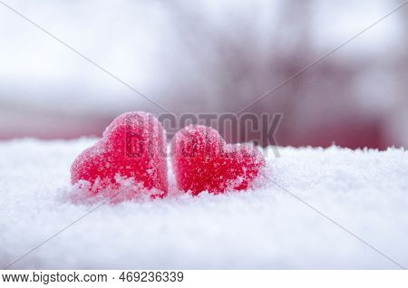Two Red Sugar Marmalade Candies In Shape Of A Heart On White Snow