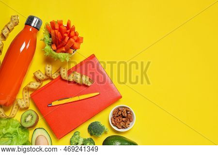Weight Loss Concept. Flat Lay Composition With Notebook, Thermo Bottle, Measuring Tape And Different