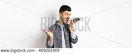 Angry Guy Shouting At Speakerphone, Scream On Mobile Phone, Leaving Angry Voice Message, Standing Ag