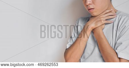 Tightness At The Neck Of Asian, Myanmar Man. Concept Of Sore Throat, Pharyngitis, Laryngitis, Esopha