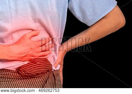 Asian Young Man Suffering From Upper Abdominal Pain. It Can Be Caused By Stomach Ache, Enteritis, Co