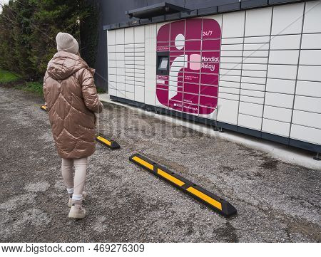 Loriol Sur Drome, France - January 14, 2023: Picking Up A Parcel From A Mondial `relay Locker By A Y