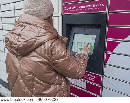 Loriol Sur Drome, France - January 14, 2023: Picking Up A Parcel From A Mondial `relay Locker By A Y