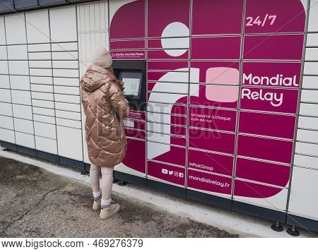 Loriol Sur Drome, France - January 14, 2023: Picking Up A Parcel From A Mondial `relay Locker By A Y