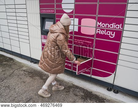 Loriol Sur Drome, France - January 14, 2023: Picking Up A Parcel From A Mondial `relay Locker By A Y