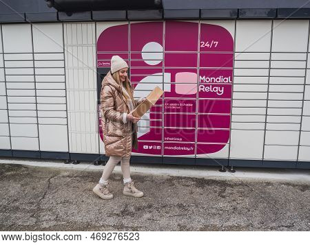Loriol Sur Drome, France - January 14, 2023: Picking Up A Parcel From A Mondial `relay Locker By A Y