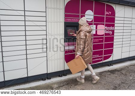 Loriol Sur Drome, France - January 14, 2023: Picking Up A Parcel From A Mondial `relay Locker By A Y