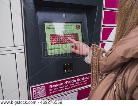 Loriol Sur Drome, France - January 14, 2023: Picking Up A Parcel From A Mondial `relay Locker By A Y