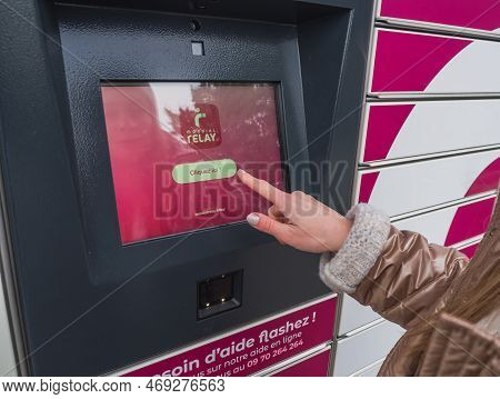 Loriol Sur Drome, France - January 14, 2023: Picking Up A Parcel From A Mondial `relay Locker By A Y