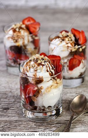 Summer Cold Dessert - Plombir Ice Cream Scoop With Chocolate Sauce, Cookie Crumbs, Ripe Strawberries
