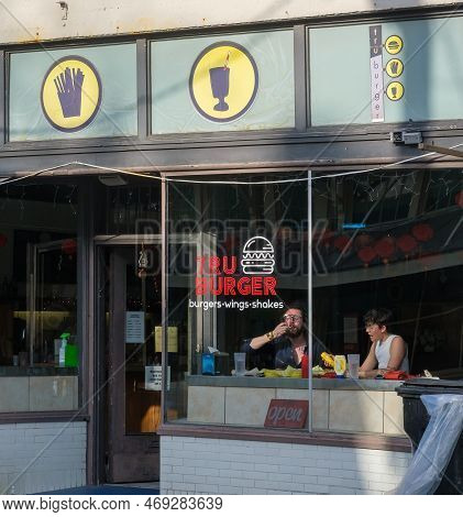 New Orleans, La - January 18: Couple Dining In The Front Window Of Tru Burger Restaurant On Oak Stre