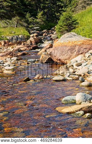 A Small Stream Which Flows Into The Atlantic Ocean At Kennington Cove Beach, Cape Breton, Nova Scoti