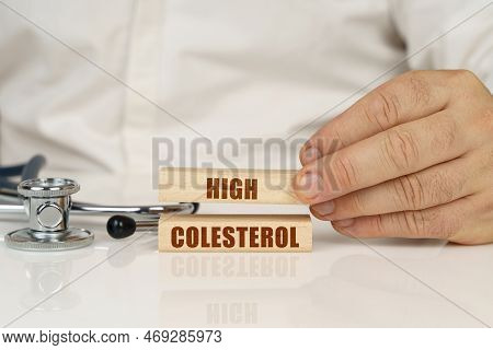 Medical Concept. On A White Surface, A Stethoscope And Wooden Plates With The Inscription - High Col