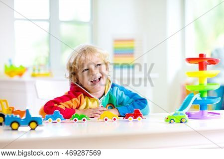 Boy Playing Toy Cars. Kid With Toys. Child And Car