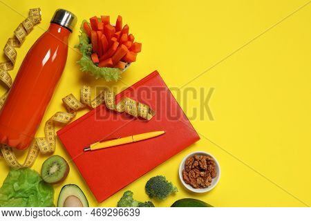 Weight Loss Concept. Flat Lay Composition With Notebook, Thermo Bottle, Measuring Tape And Different