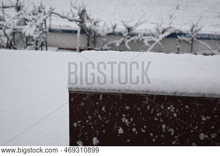 Fresh Snow Amount Fallen In An Hour Visible On The Dark Roof