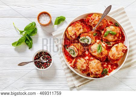 Chicken Rollatini With Spinach Ricotta Filling In Marinara Sauce Topped With Mozzarella Cheese And F