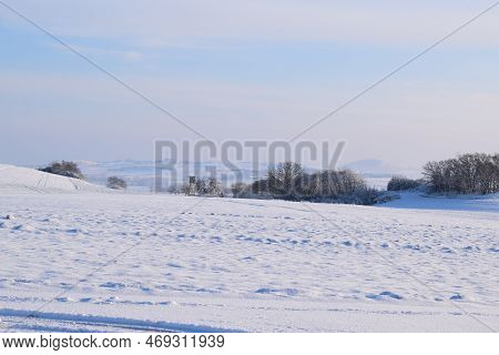 Snow Covered Landscape With Fields Under Snow