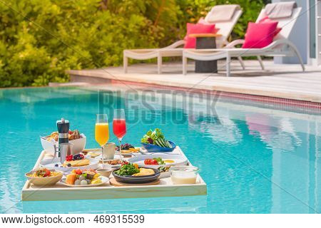 Breakfast In Swimming Pool, Floating Breakfast In Luxurious Tropical Resort. Table Relaxing On Calm 