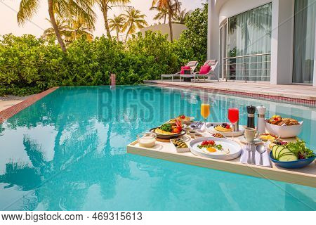 Breakfast In Swimming Pool, Floating Breakfast In Luxurious Tropical Resort. Table Relaxing On Calm 