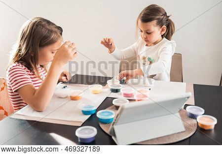 Little Girls Sculpt Figurines Crafts From Air Plasticine, Modeling Dough.online Lessons In Tablet. C