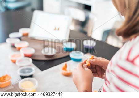 Little Girls Sculpt Figurines Crafts From Air Plasticine, Modeling Dough.online Lessons In Tablet. C
