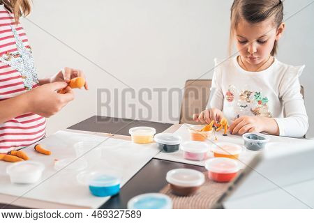 Little Girls Sculpt Figurines Crafts From Air Plasticine, Modeling Dough.online Lessons In Tablet. C