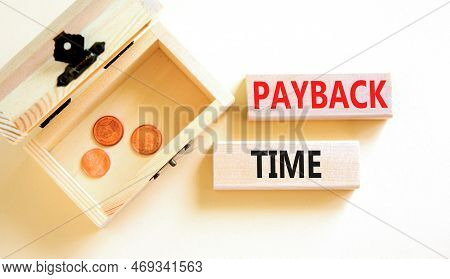 Payback Time Symbol. Concept Words Payback Time On Wooden Blocks. Beautiful White Table White Backgr
