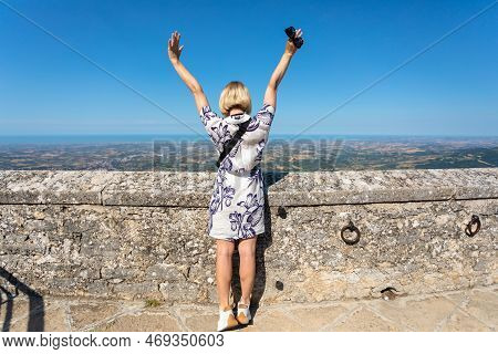 Young Beautiful Woman Visits The Sights Of The Republic Of San Marino, Italy