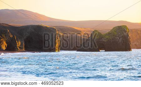 Scenic Beach With Black Sand By Low Tide At Sunset Near Kopasker Village, Volcanic Coastline In Icel